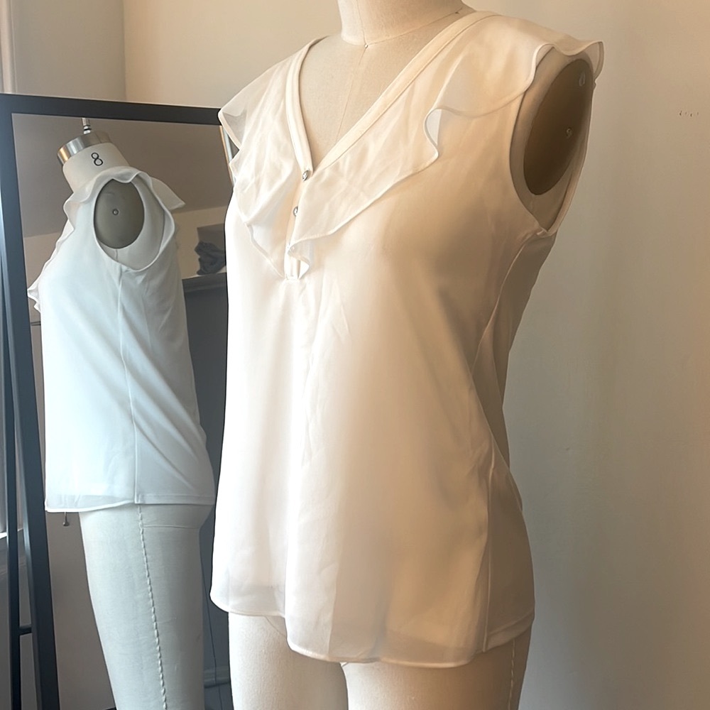 Ivory Calvin Klein sleeveless top with button and ruffle detail, size XS